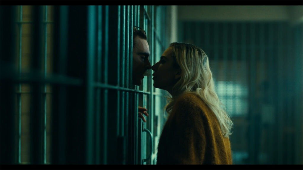 Arthur Fleck (played by Joaquin Phoenix) and Lady Gaga (portraying Harley Quinn) in a scene from the “Joker: Folie À Deux” trailer. Arthur, a failed comedian, meets Harley while incarcerated at Arkham State Hospital. Upon his release, they embark on a doomed romantic misadventure, unleashing chaos in Gotham City.