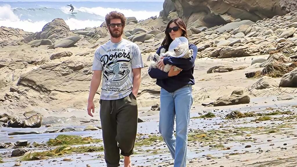 Andrew Garfield and Monica Barbaro walking in Malibu